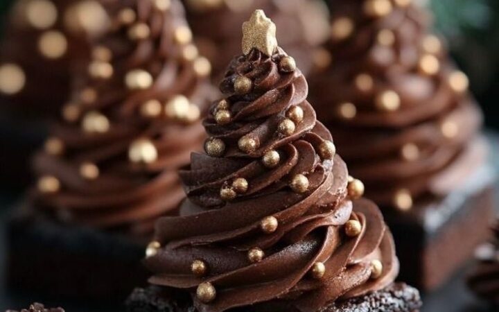 chocolate cupcakes with frosting and gold sprinkles