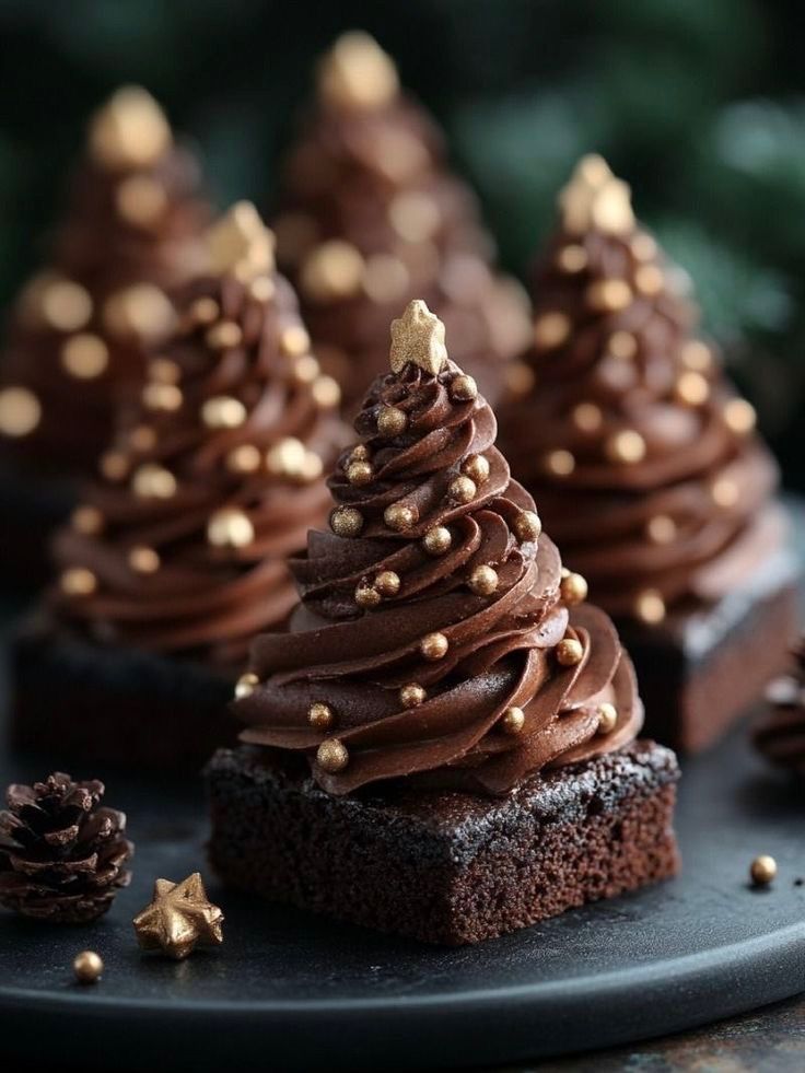 chocolate cupcakes with frosting and gold sprinkles