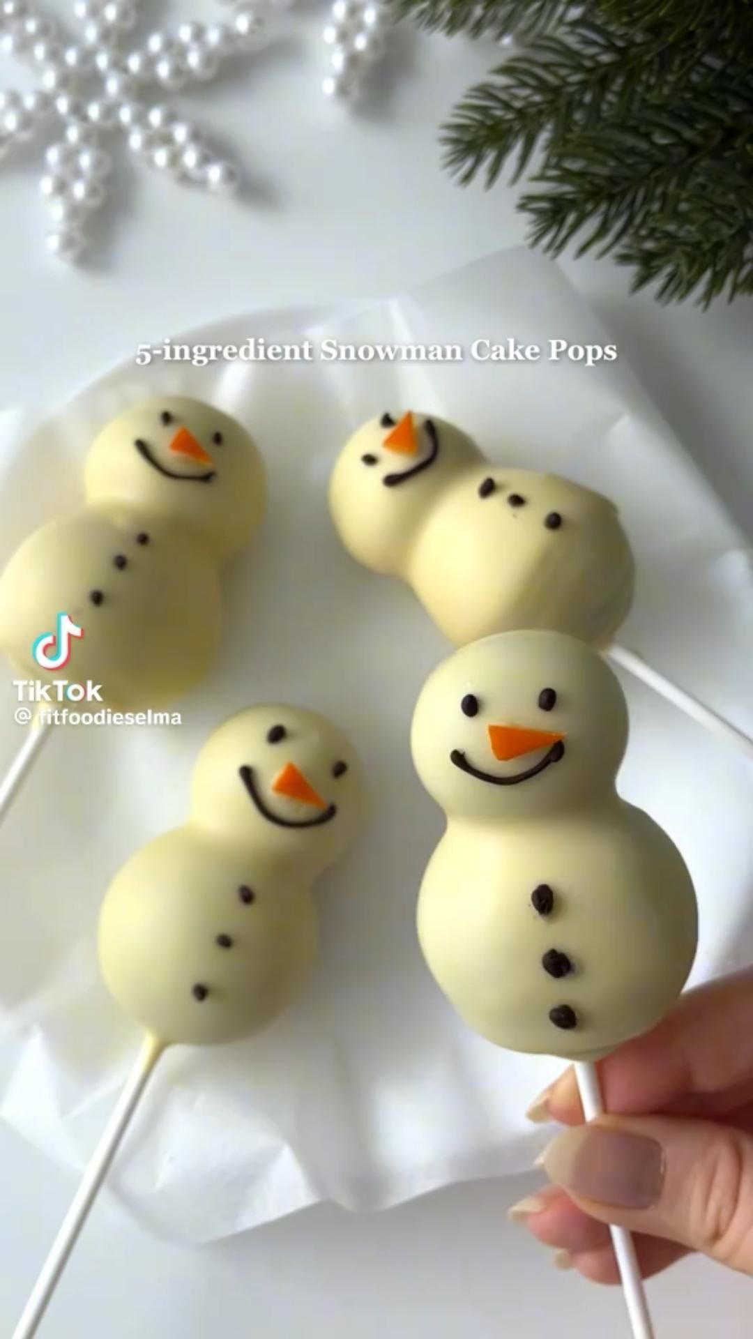 Snowman Cake Pops on a White Plate